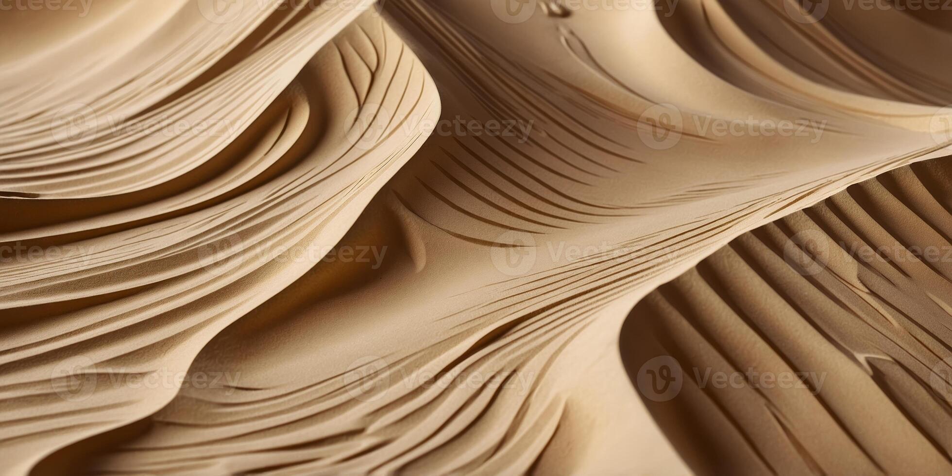 Detailed view of smooth, wavy sand formations in a desert landscape during golden hour sunlight photo