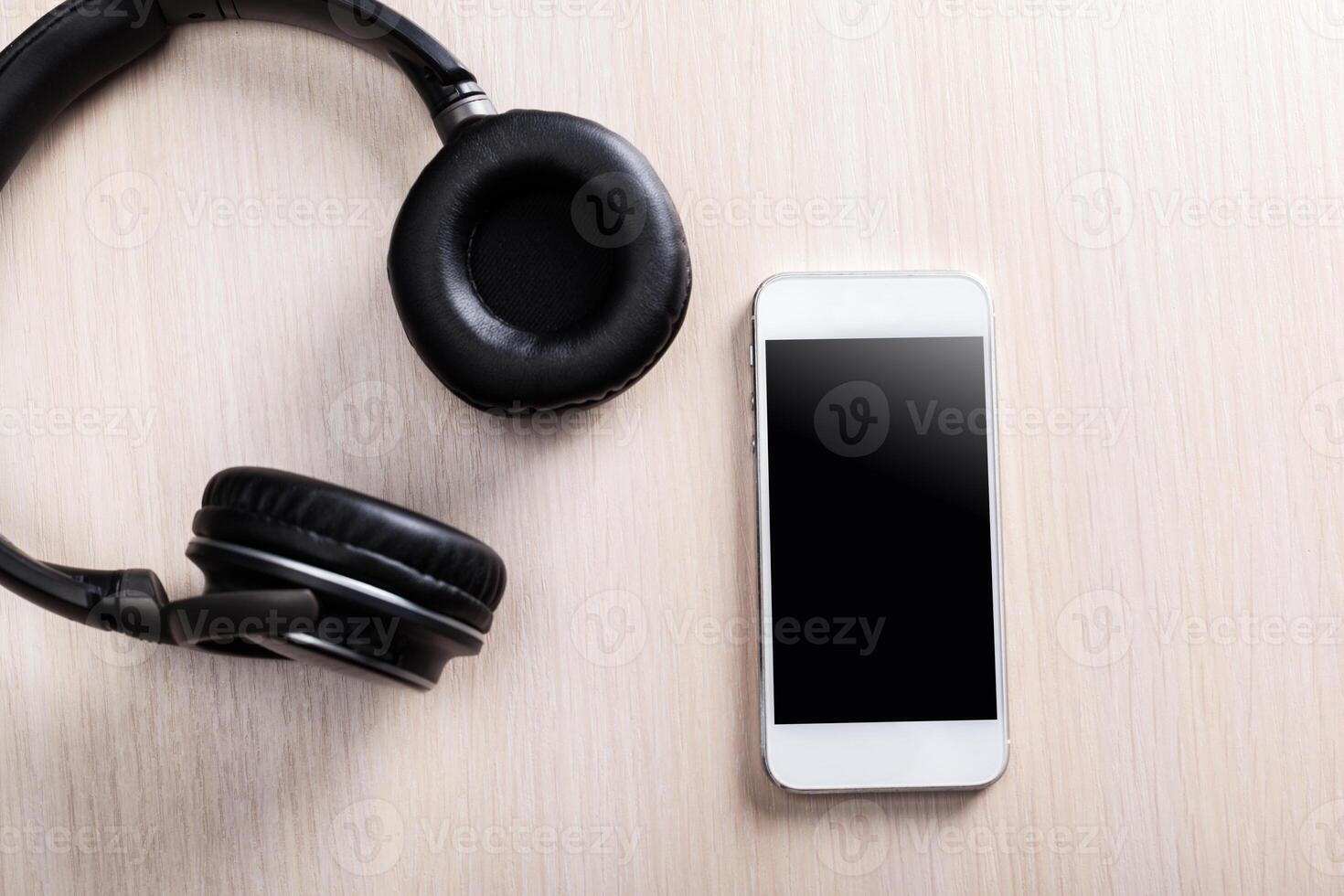 headphones on wooden background photo