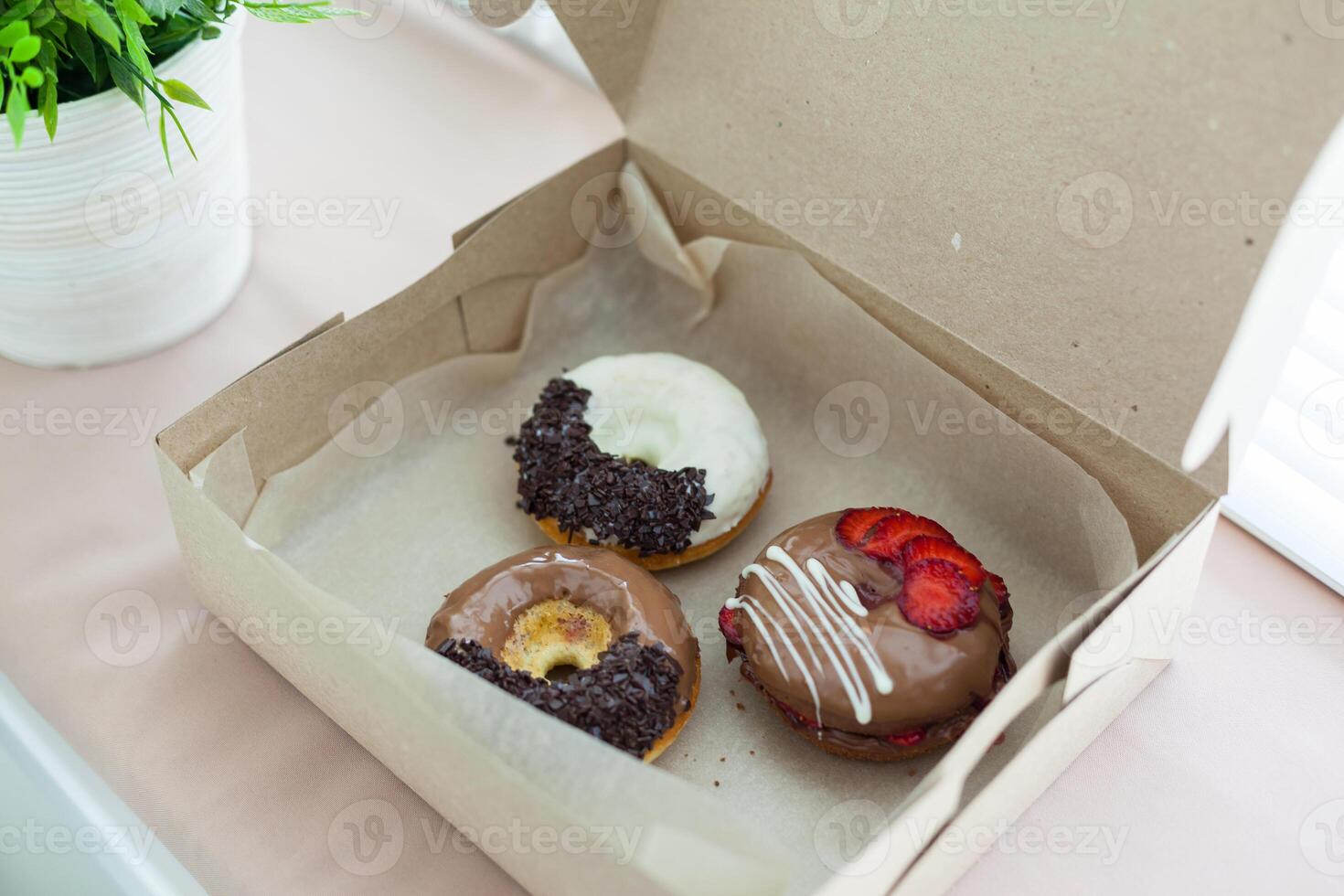 Colorful donuts in box photo
