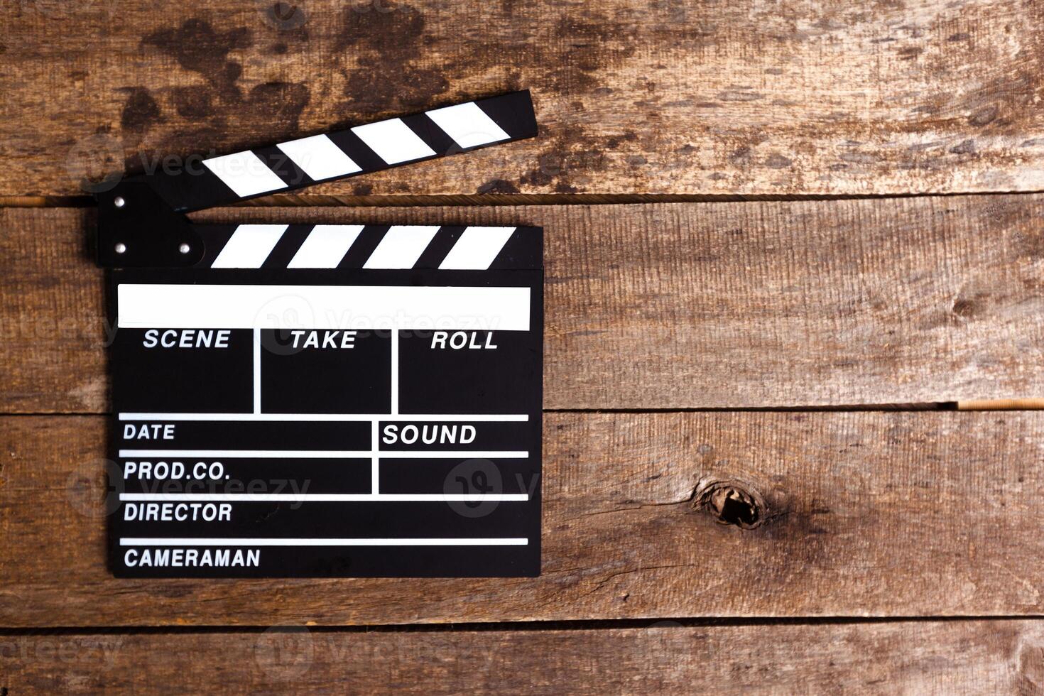 photo of movie clapper on wood