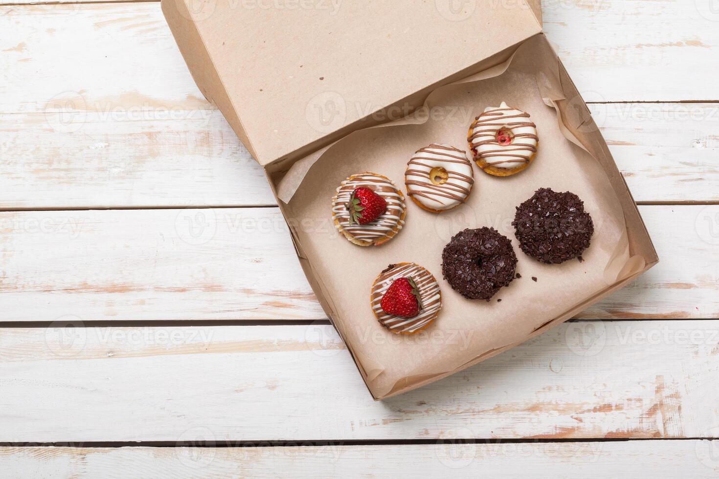 Colorful donuts in box photo