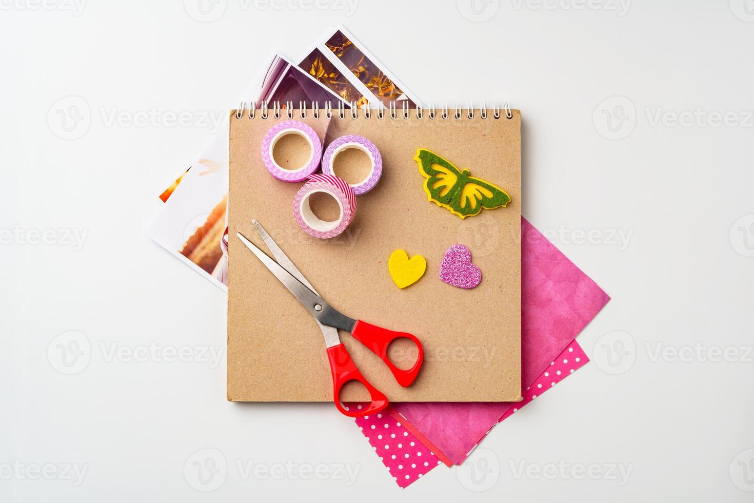 Crafting materials arranged for a colorful creative project on a white background photo