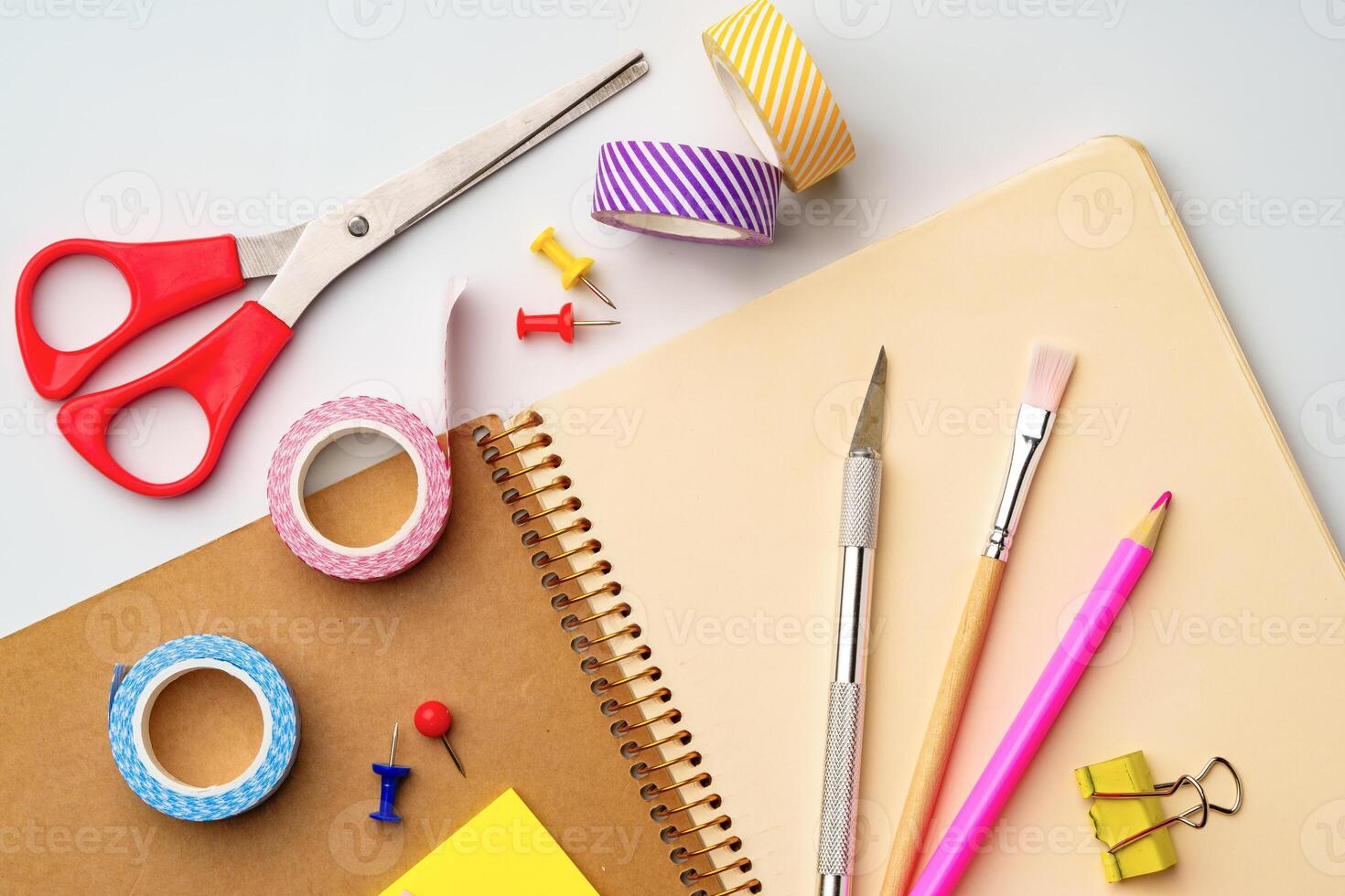Crafting tools and supplies arranged on a workspace for creative projects and organization photo
