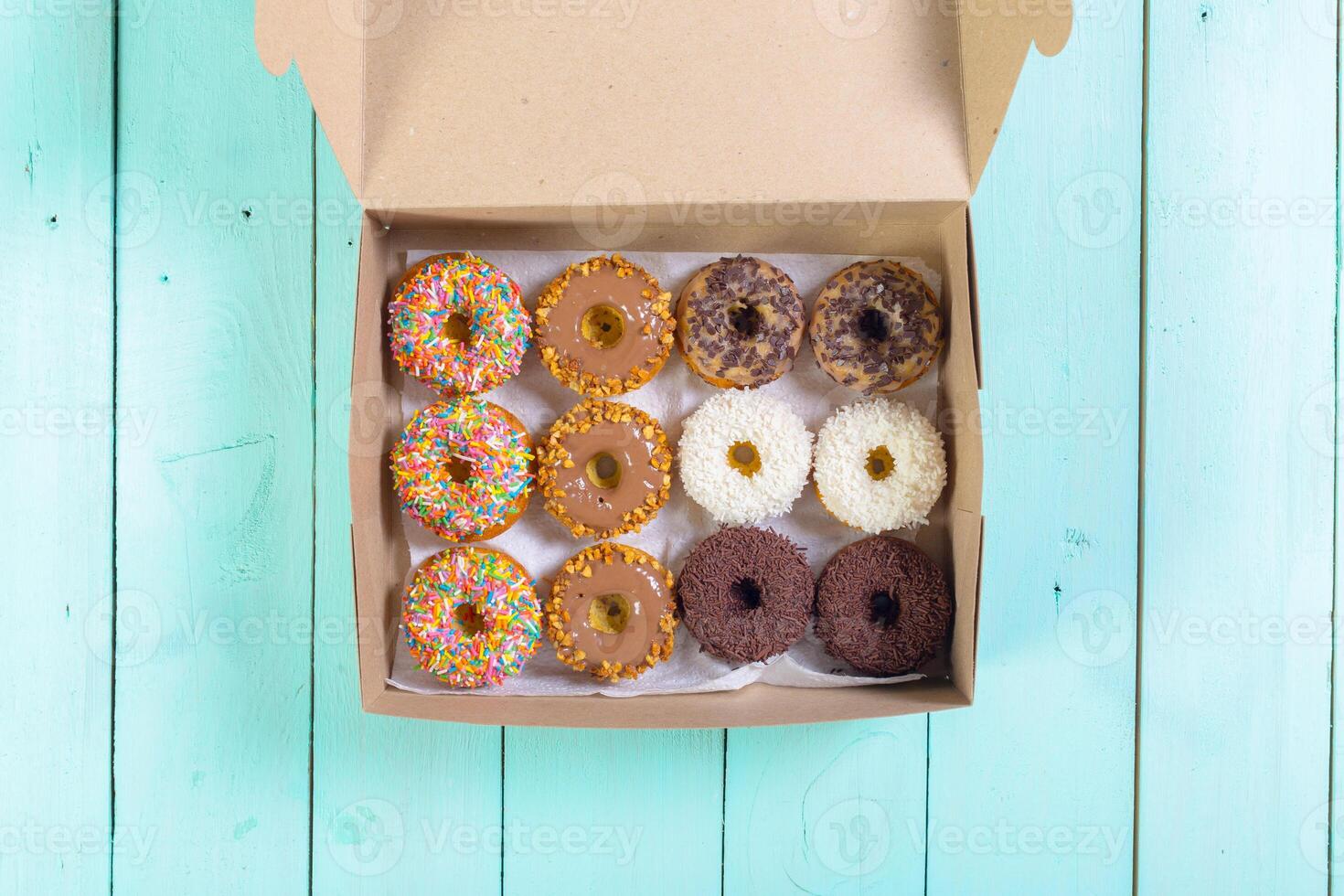 Colorful donuts in box photo
