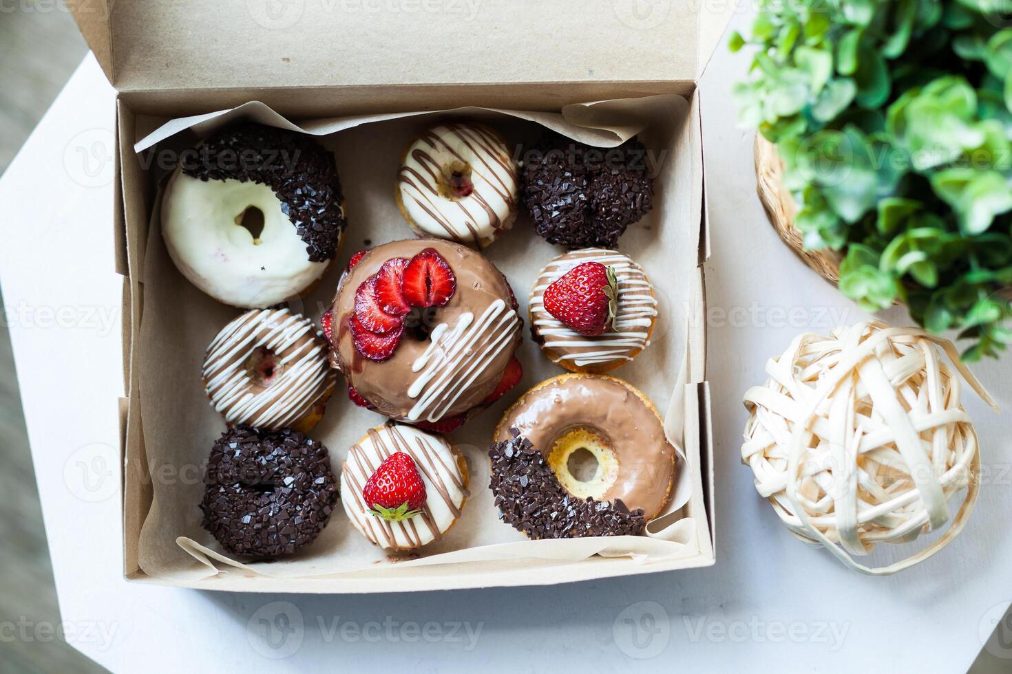 Colorful donuts in box photo
