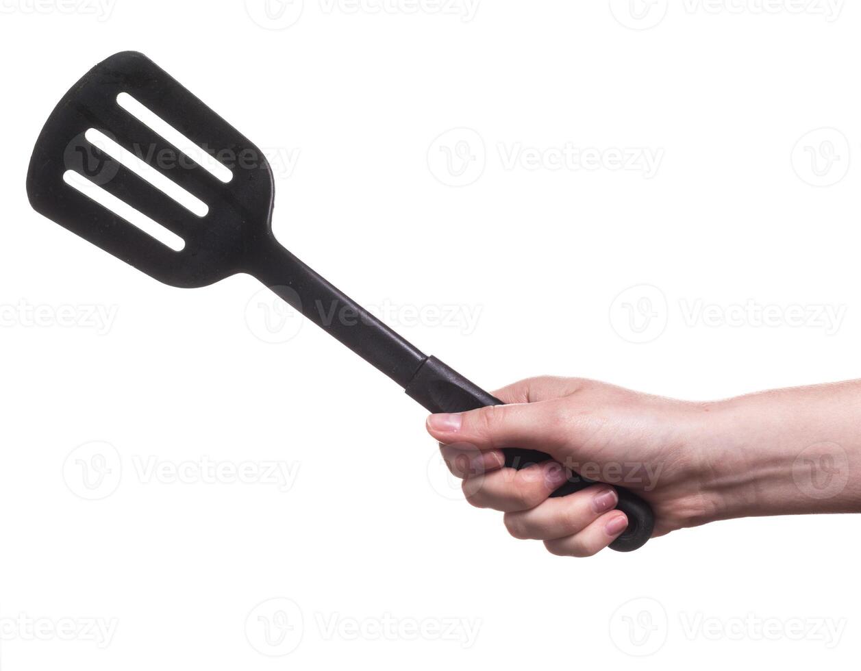 kitchen utensils in the hand of women isolated on white background photo