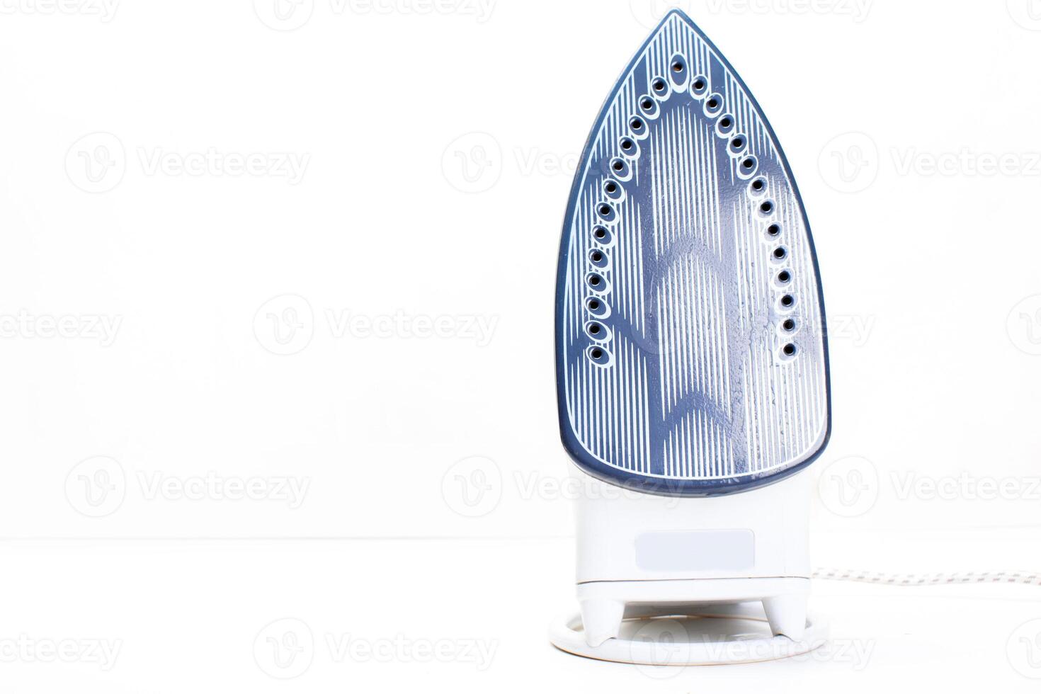 Steam iron isolated on white background photo
