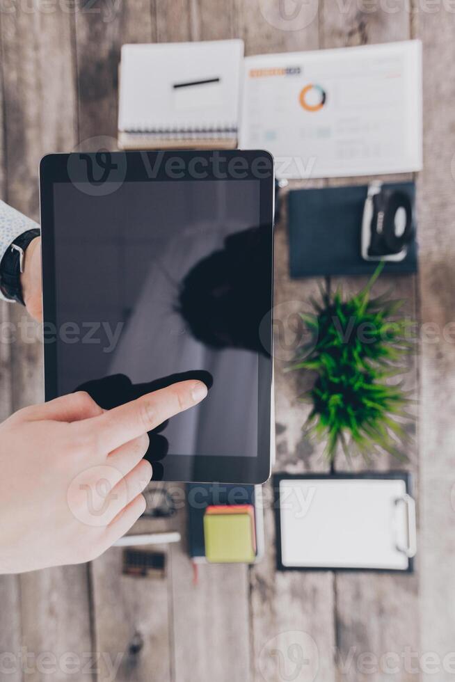 Young businessman working with modern devices photo