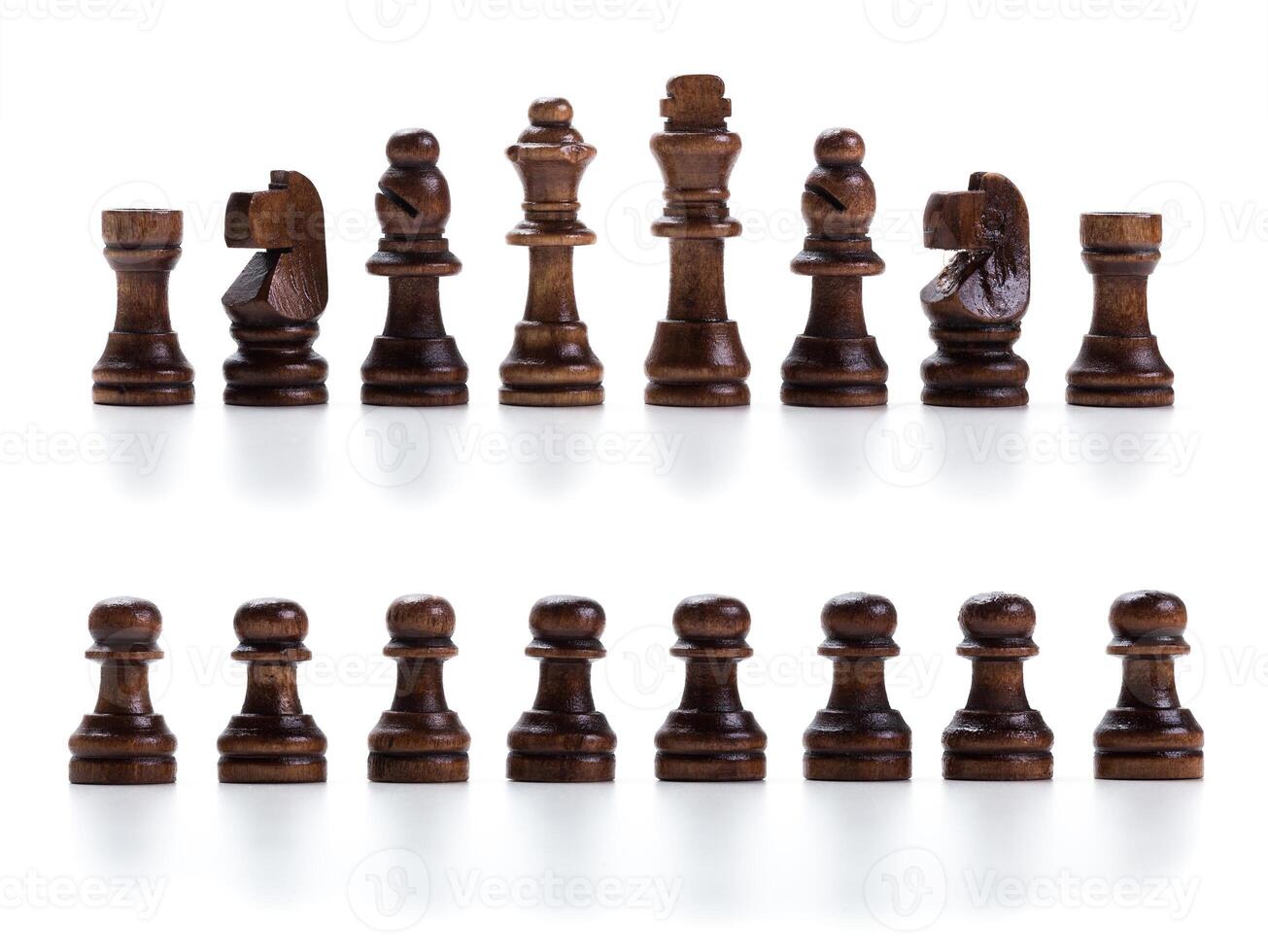 wooden chess set lined up in rows isolated photo