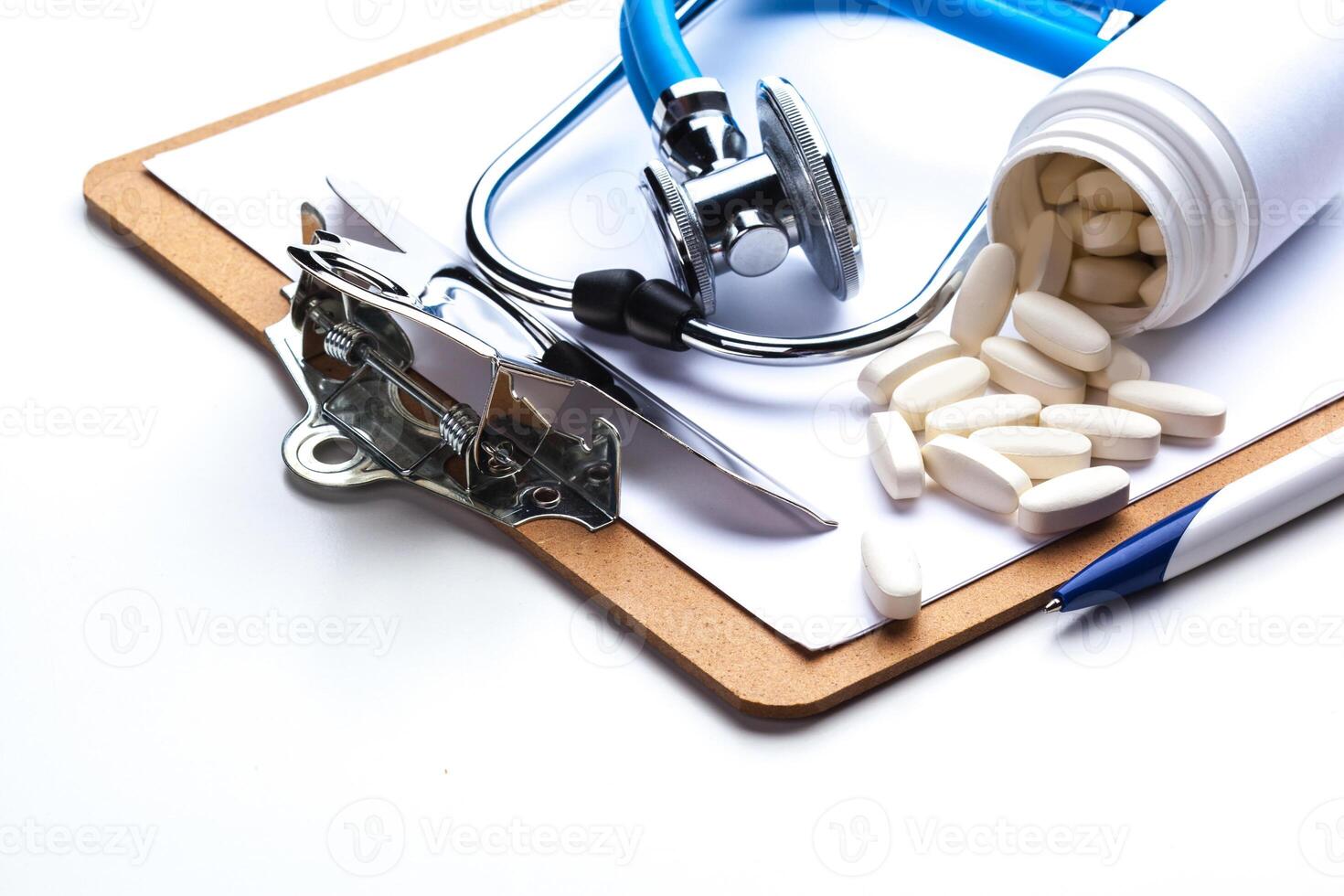 Empty prescription lying on table with stethoscope photo