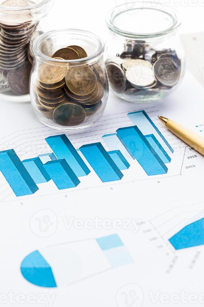 Graph Of Stock Market With Stacks Of Coins photo