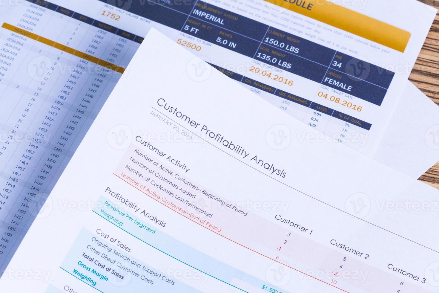 Financial paper charts and graphs on the table photo