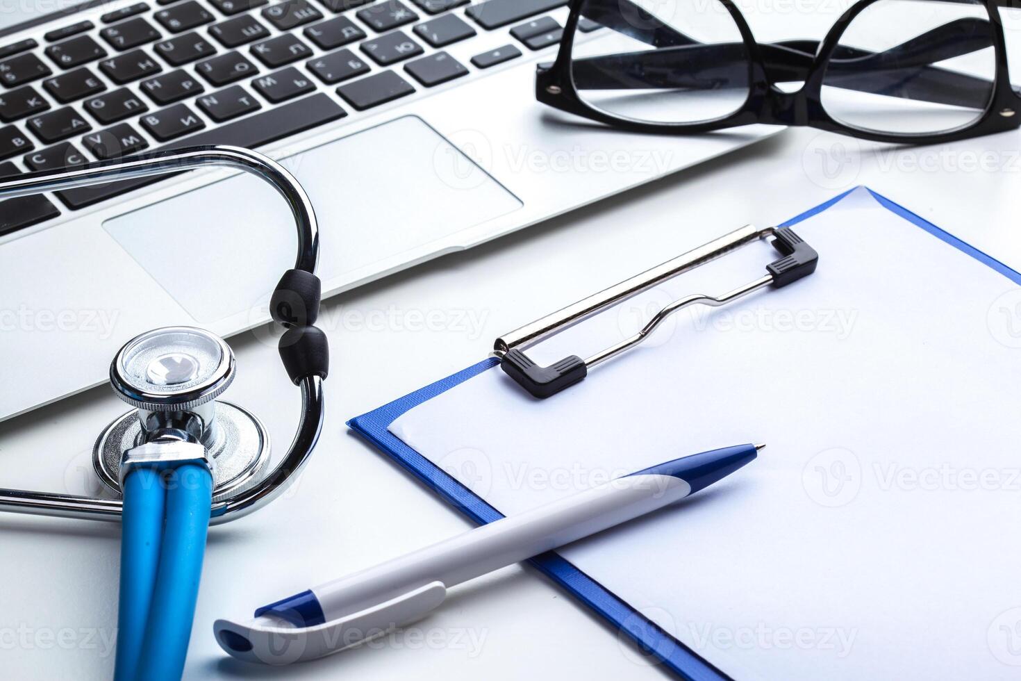 Medical stethoscope on computer keyboard photo