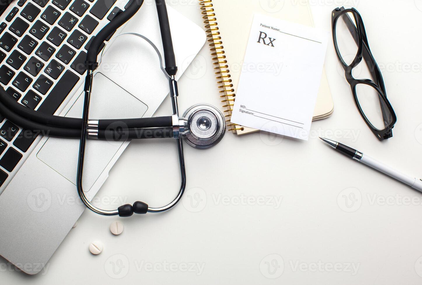 Medical stethoscope on computer keyboard photo