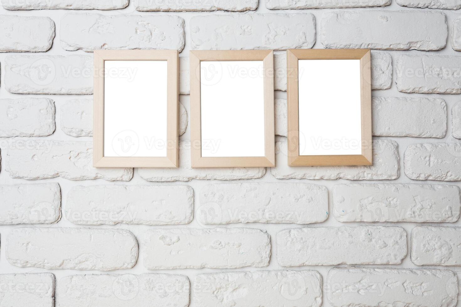 blank black picture frame on the wall photo