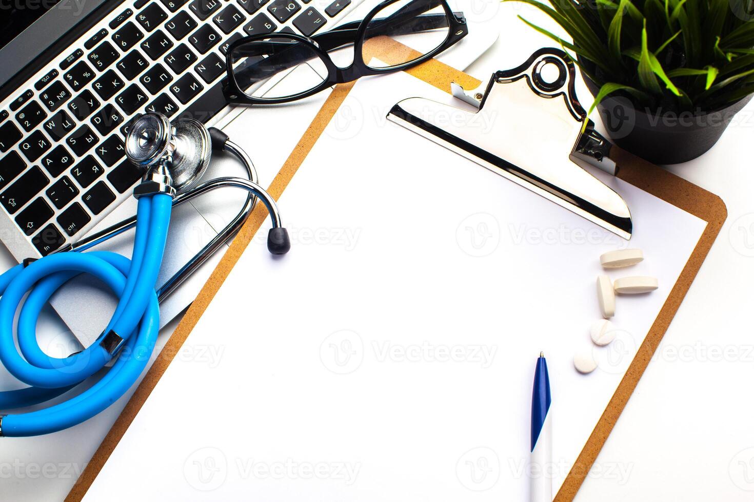 Medical stethoscope on computer keyboard photo