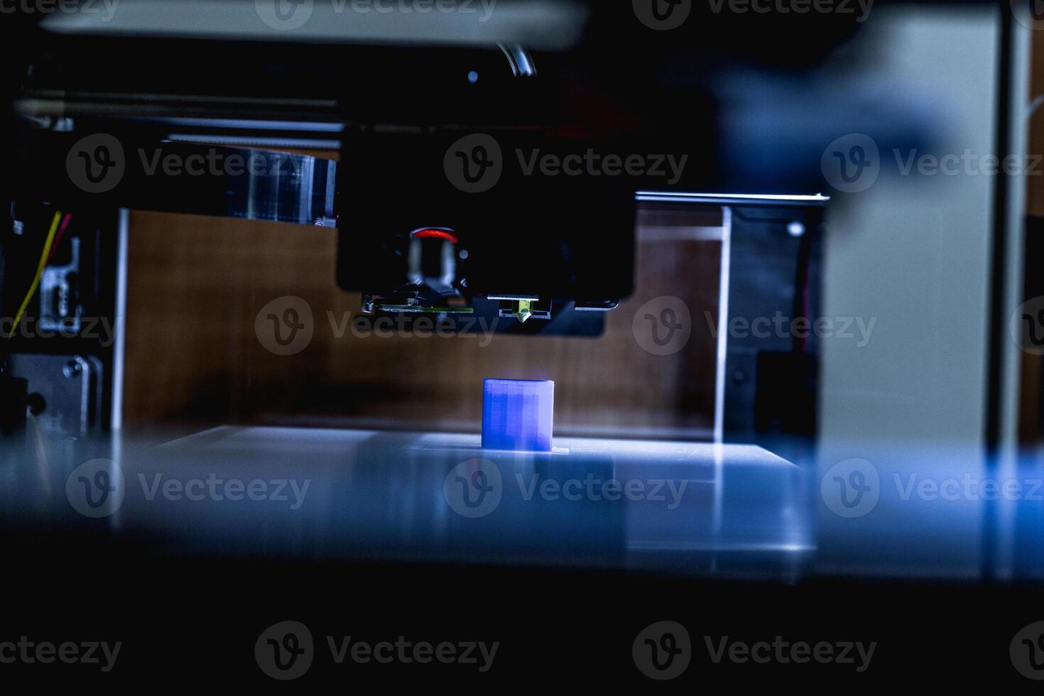 head of 3d printer in action photo