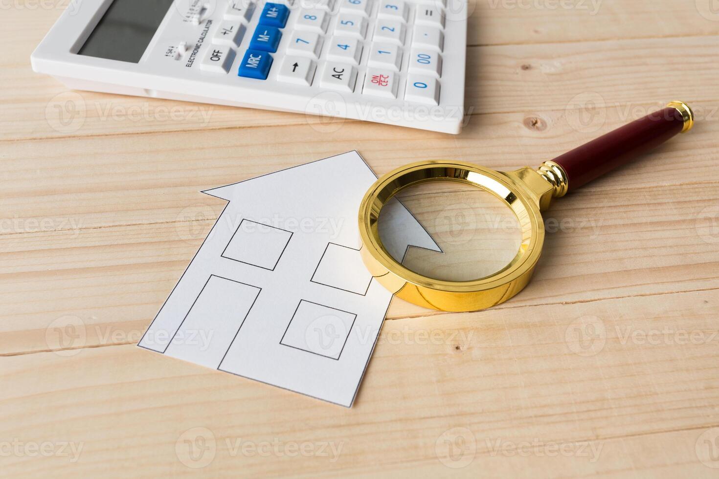 Calculator with a magnifying glass photo