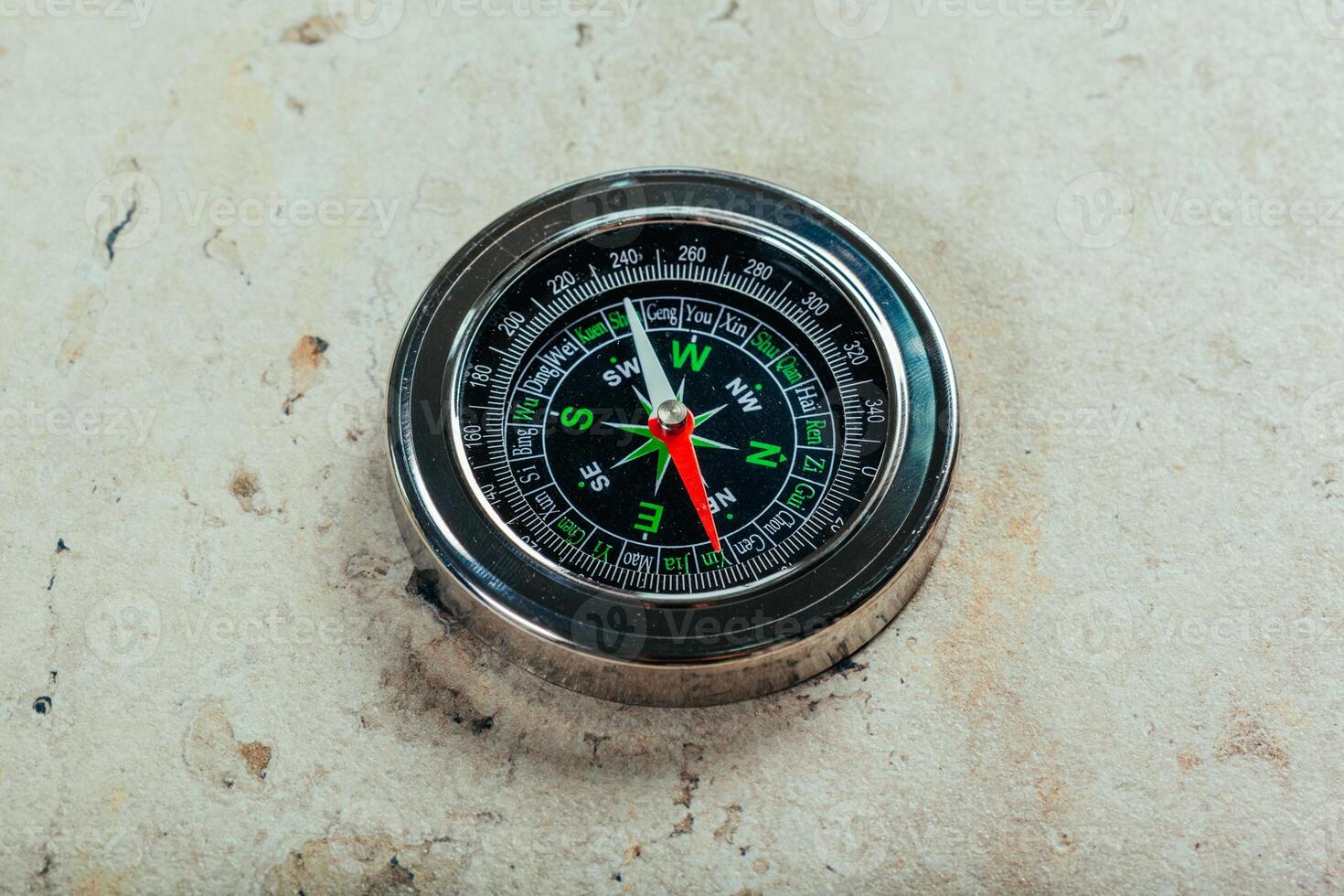 Compass on a gray gradient background photo