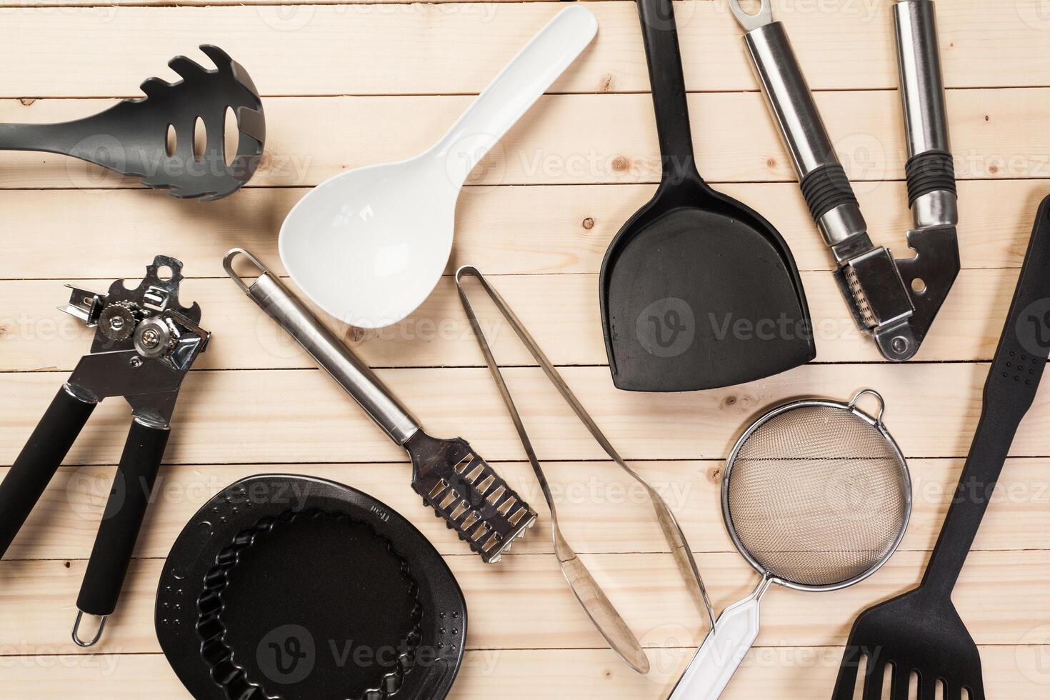 cookware and accessories on a wooden table. photo