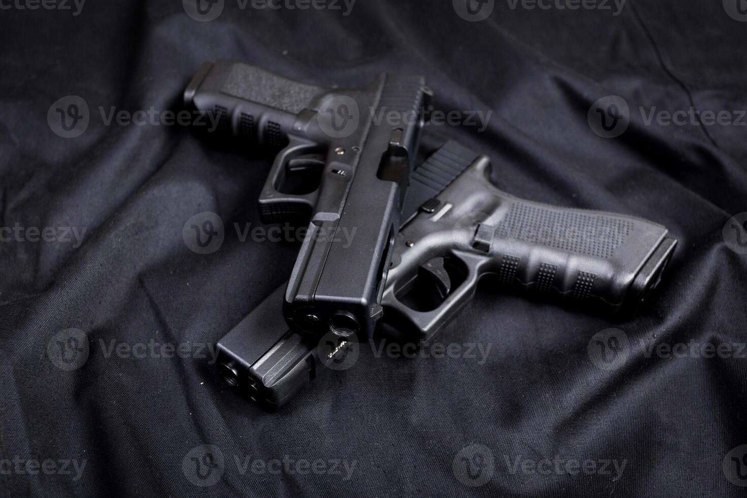 handgun on black background photo