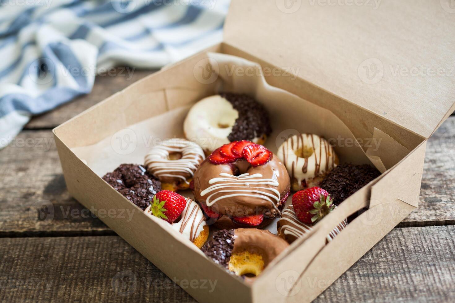 Colorful donuts in box photo