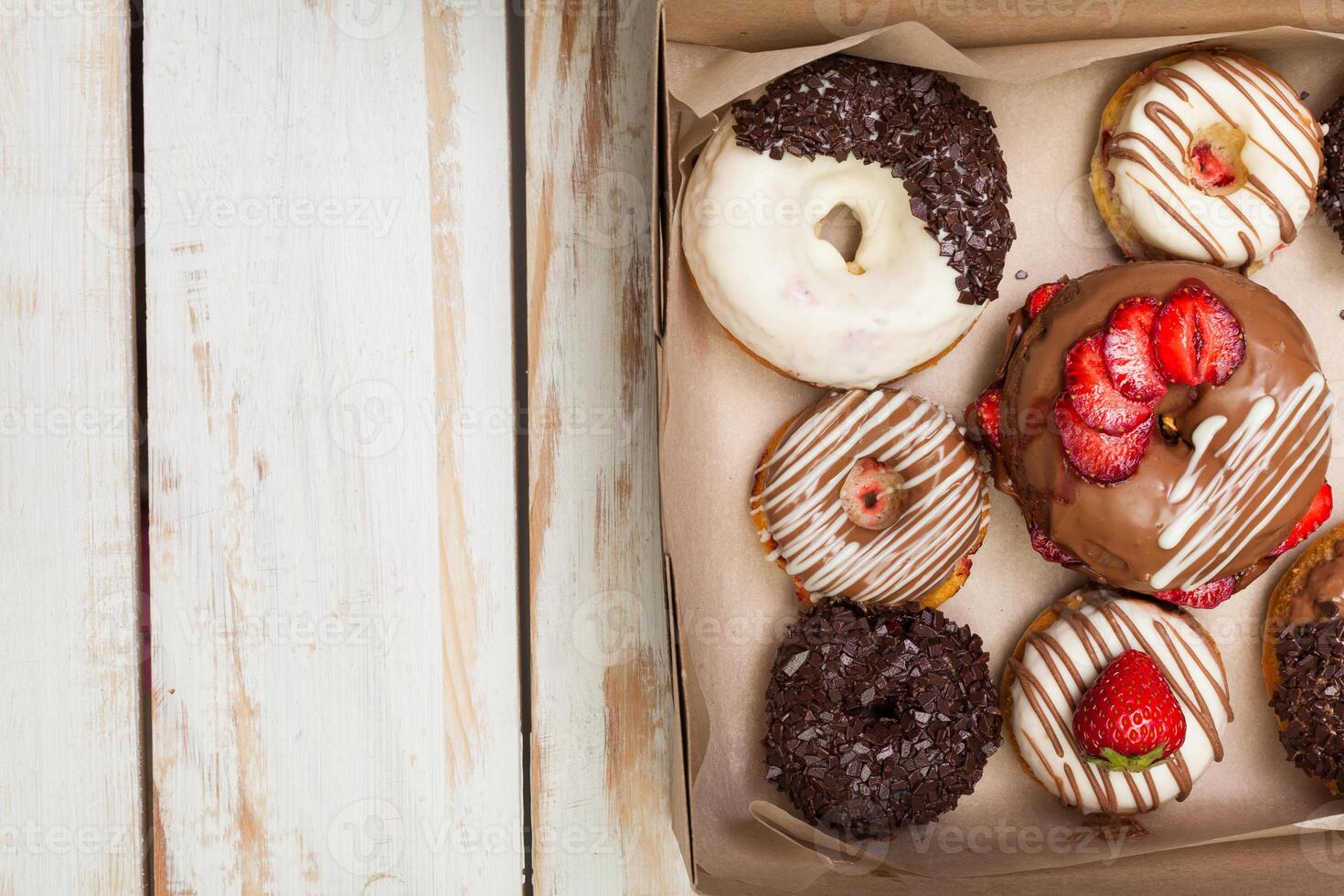 Colorful donuts in box photo