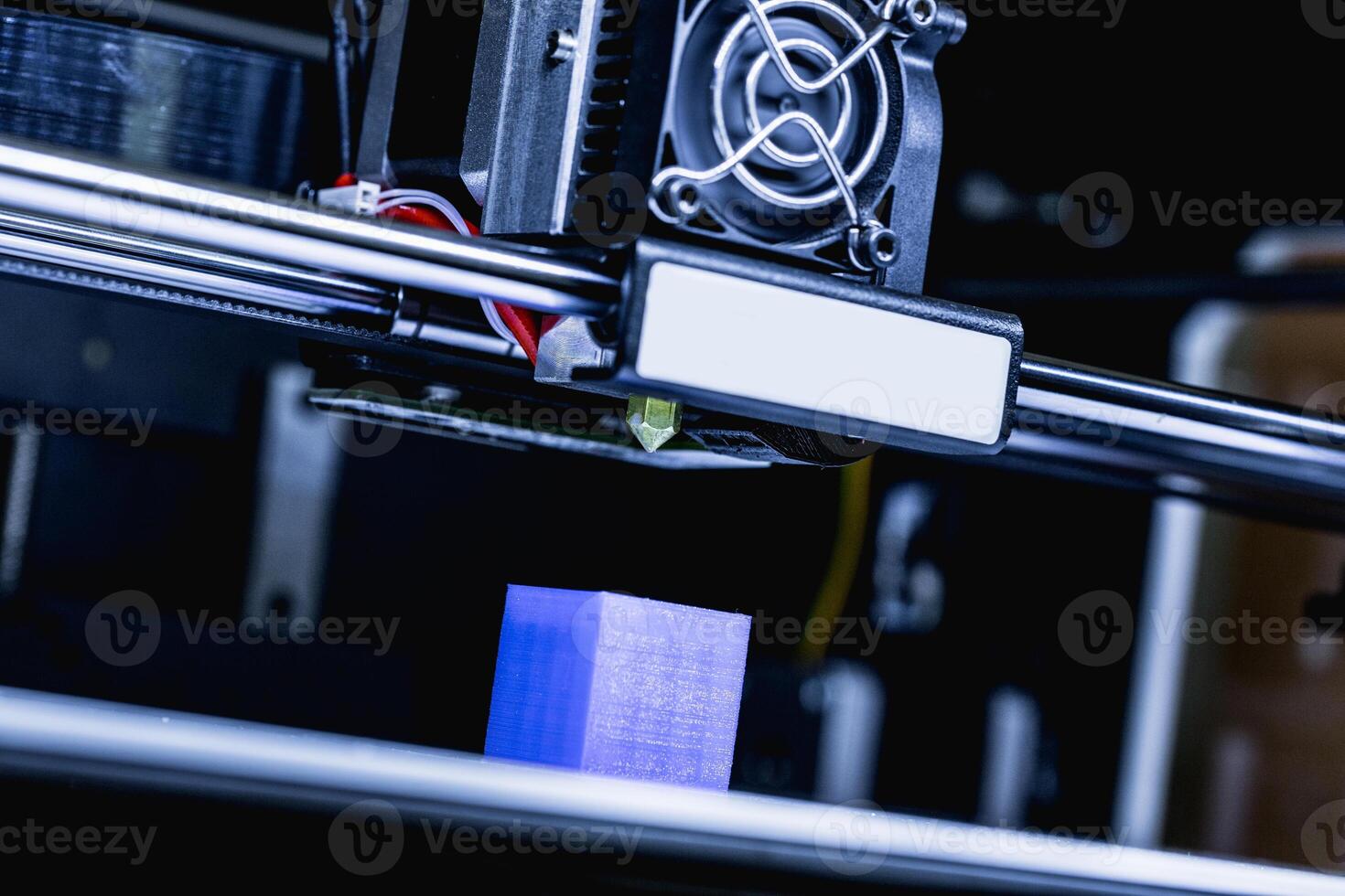head of 3d printer in action photo