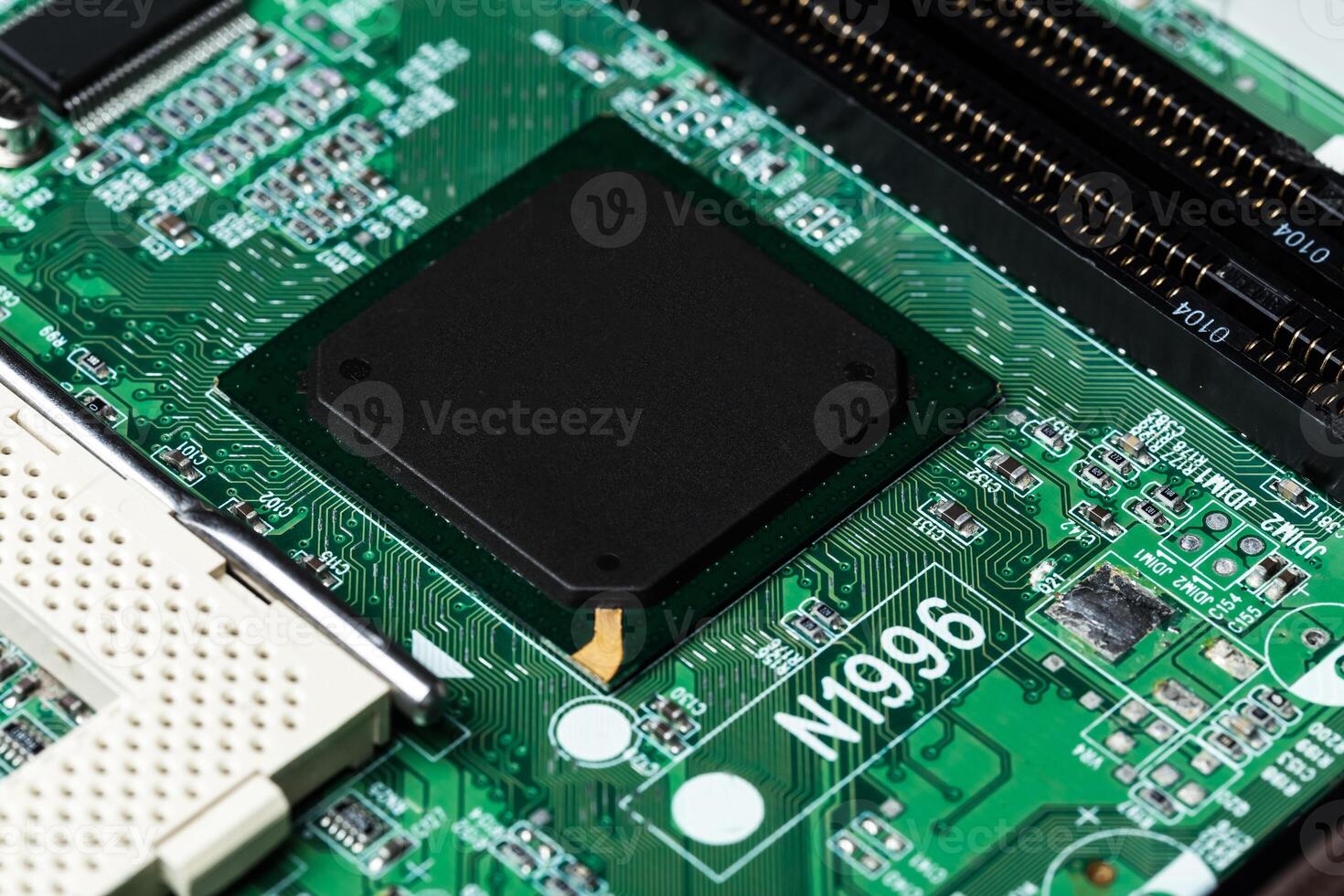 Close up of a printed green computer circuit board photo