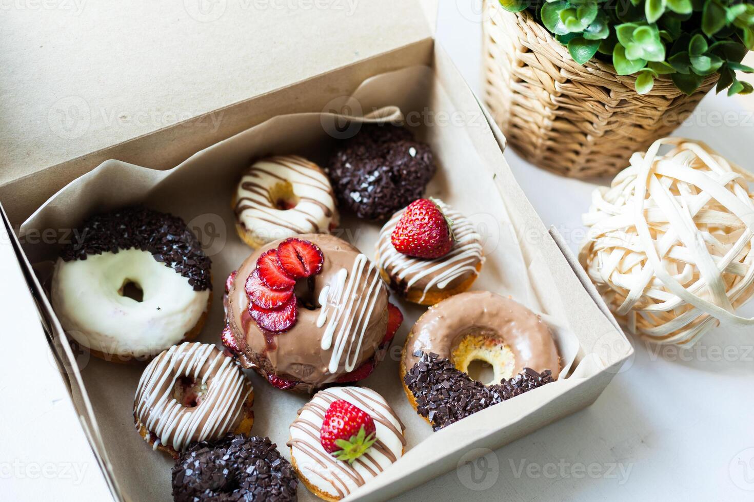 Colorful donuts in box photo