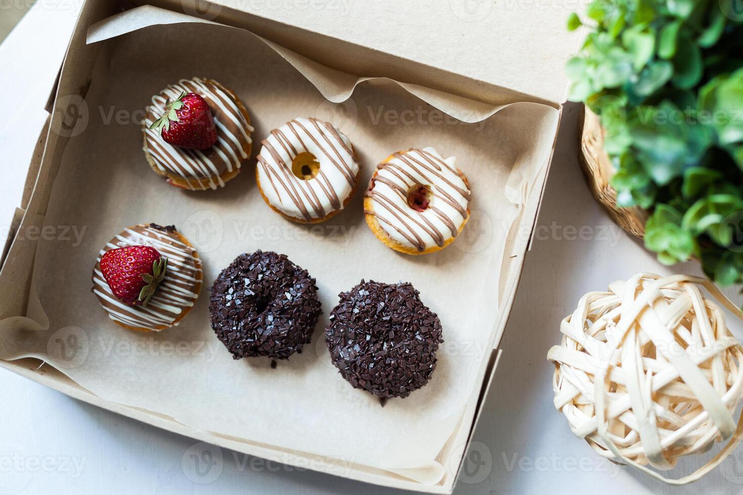 Colorful donuts in box photo