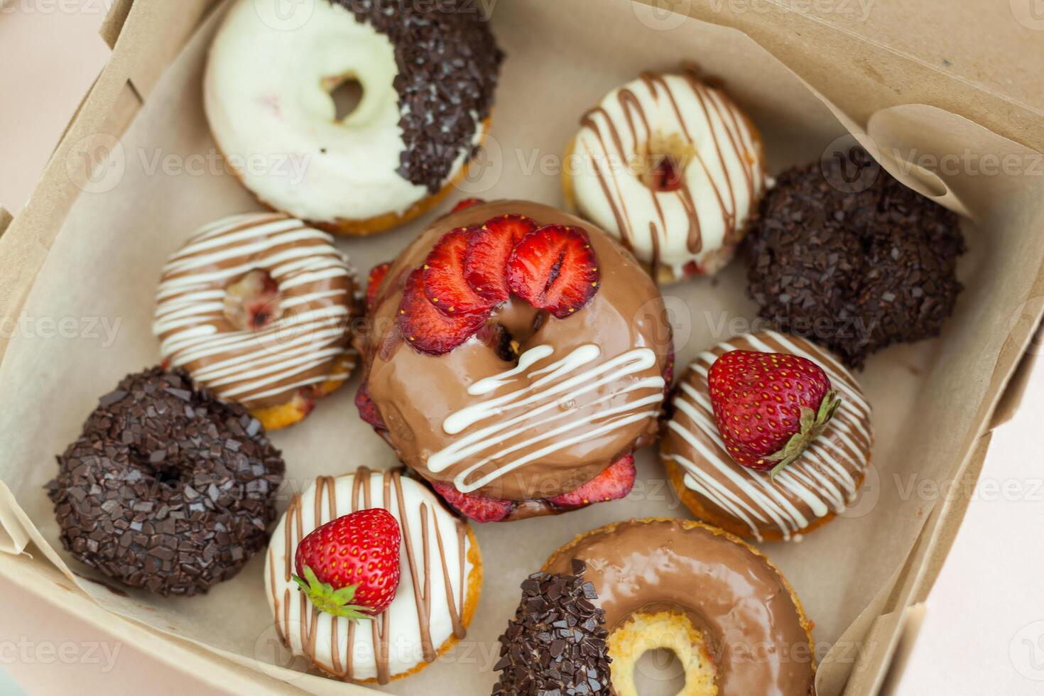 Colorful donuts in box photo