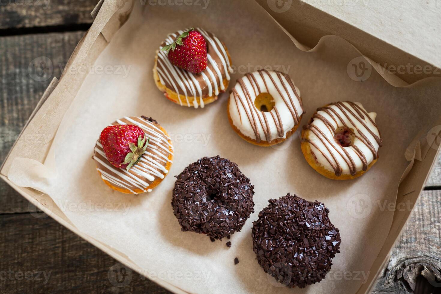 Colorful donuts in box photo