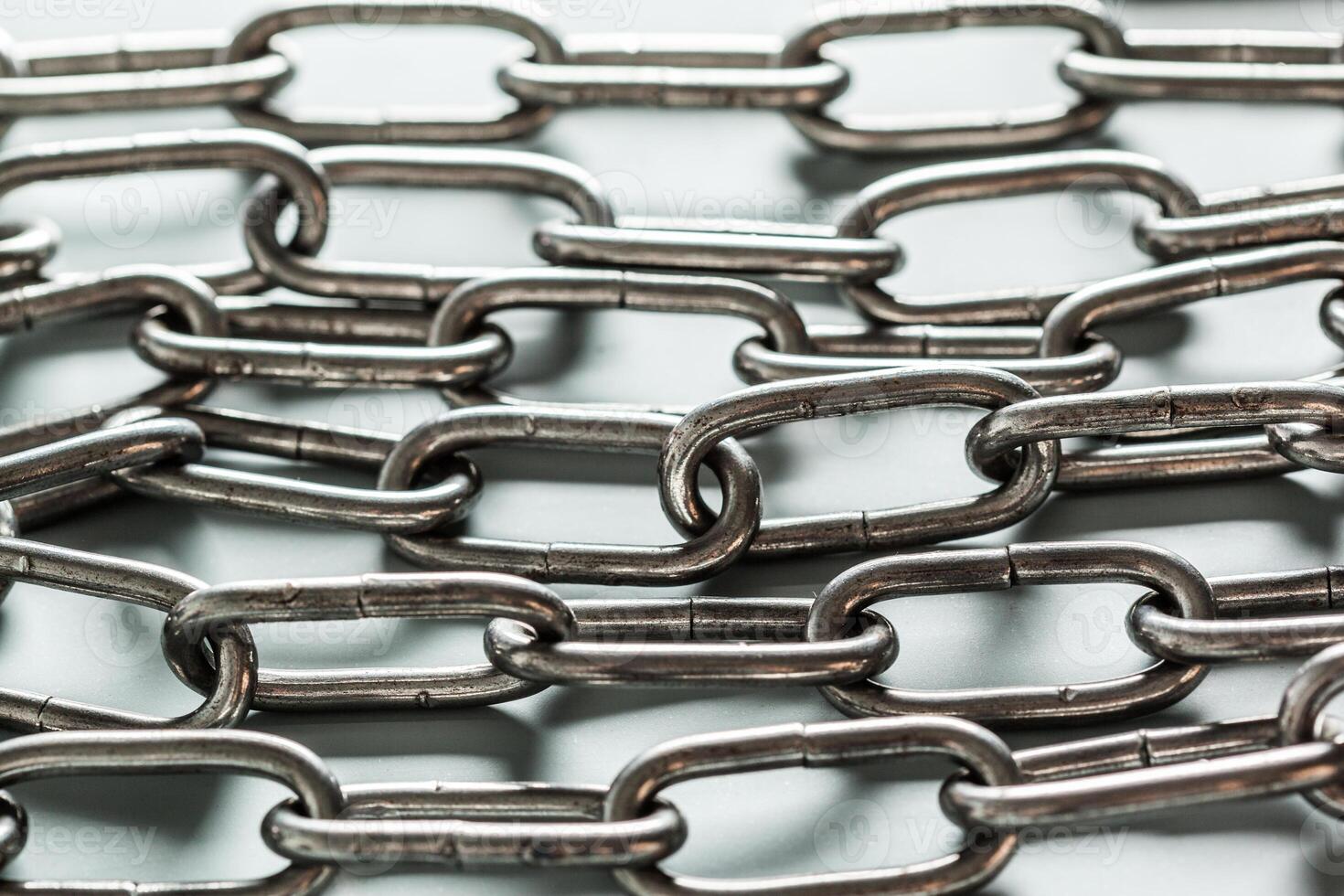 close up of metal chain part on white background photo