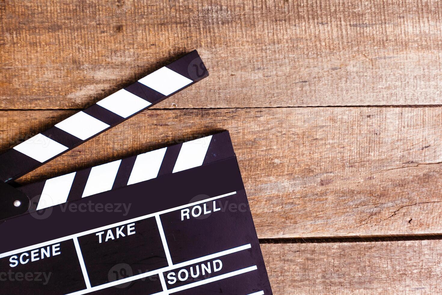 photo of movie clapper on wood