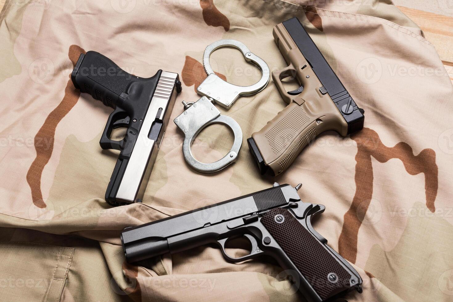 Pile of handguns photo