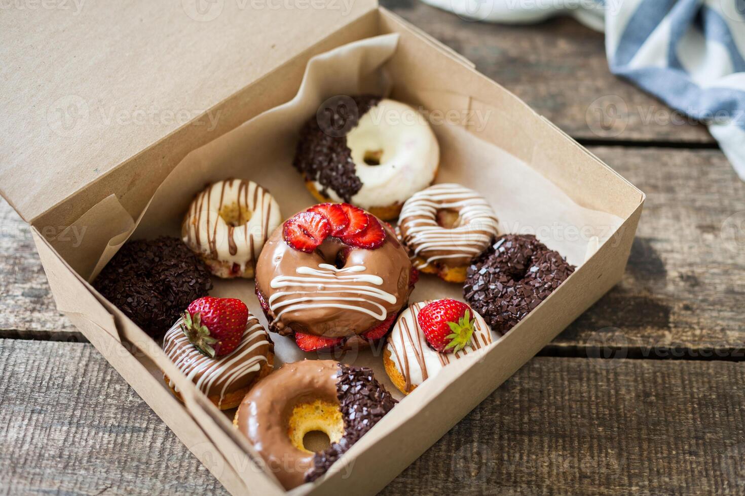 Colorful donuts in box photo
