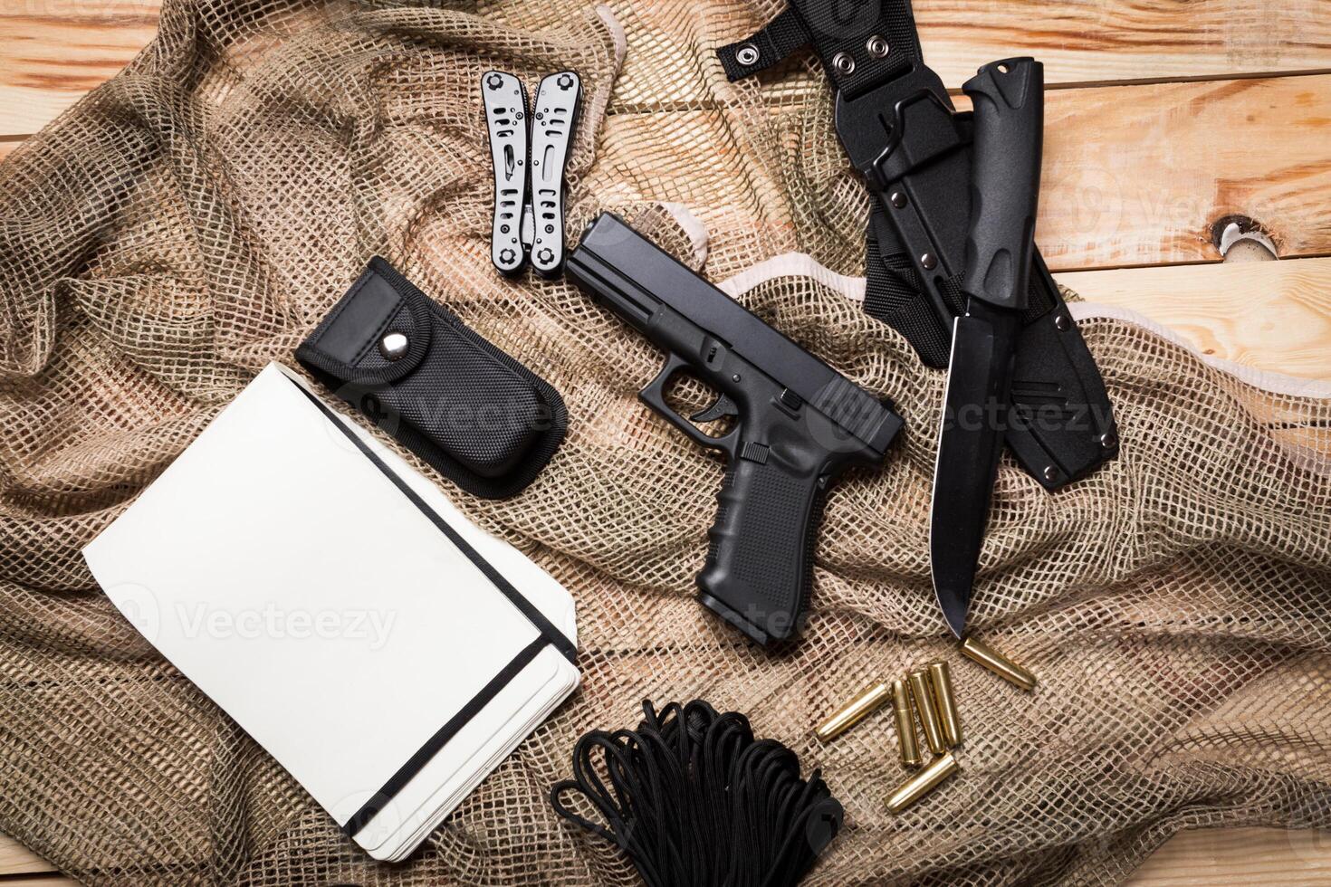 gun, knife with sheath, compass photo