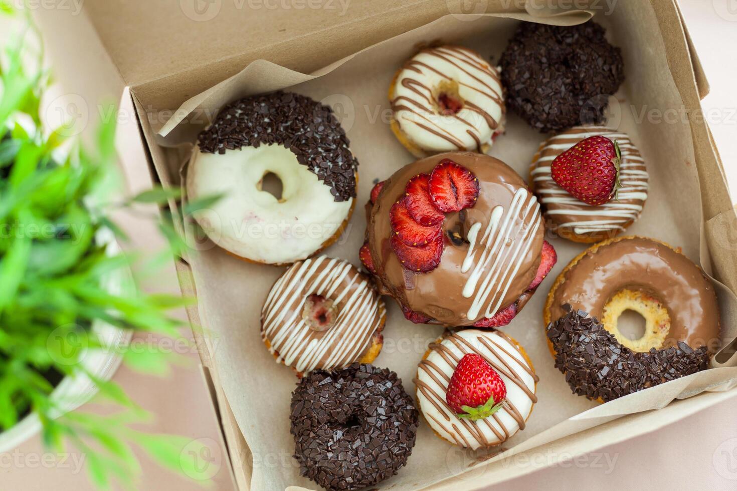 Colorful donuts in box photo