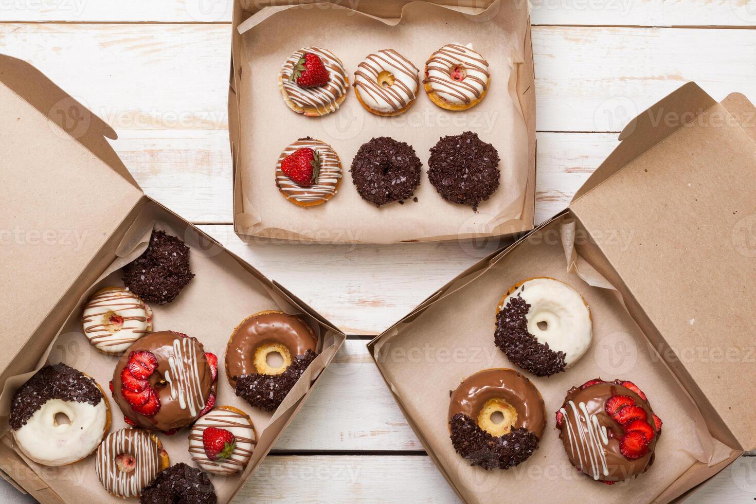 Colorful donuts in box photo
