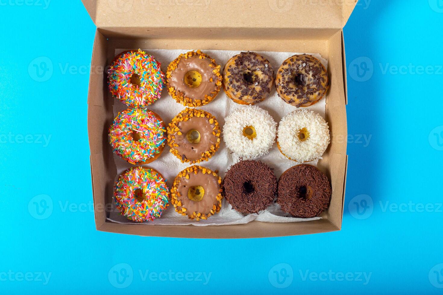 Colorful donuts in box photo