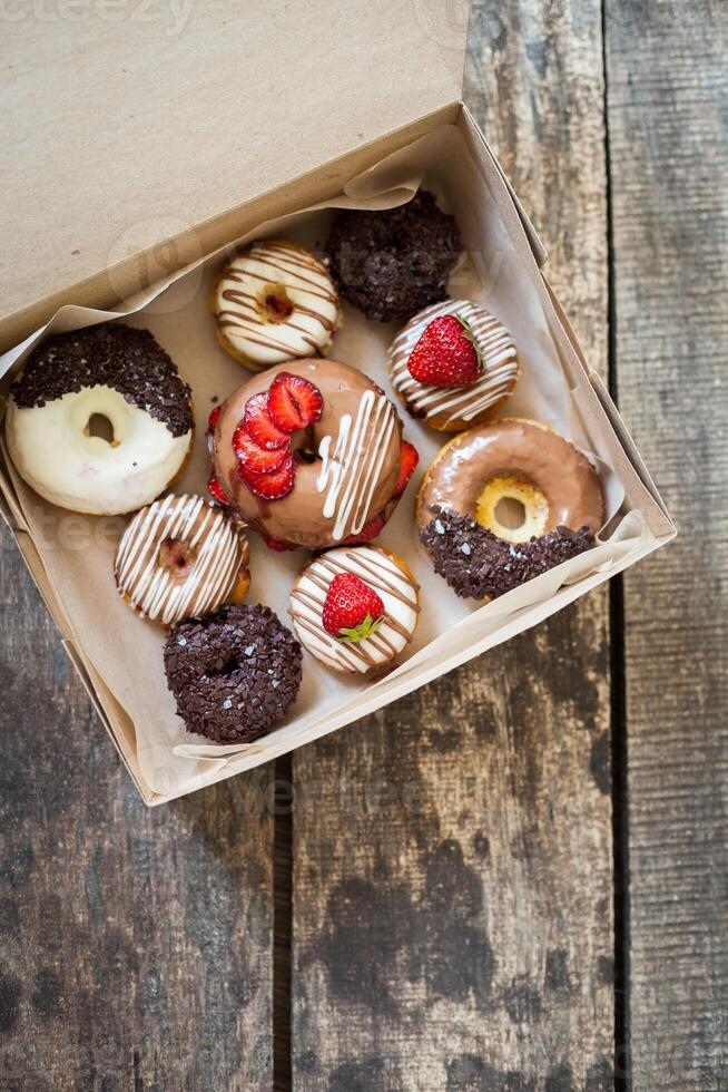 Colorful donuts in box photo