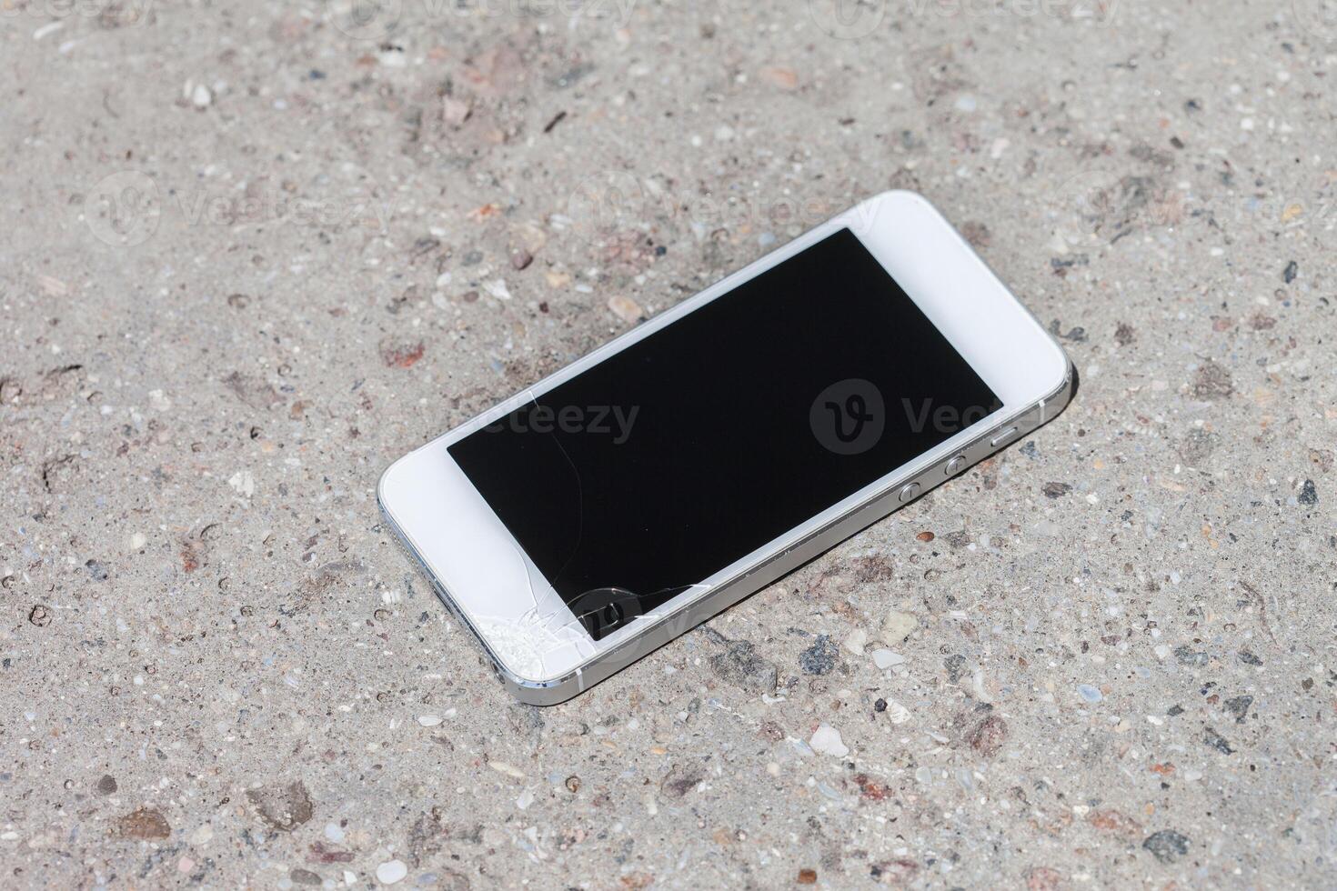 Smartphone drop to the floor and screen damage photo