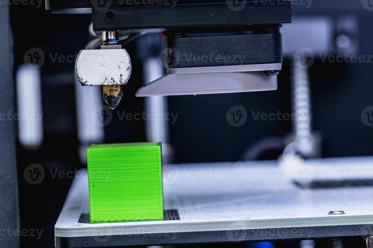 head of 3d printer in action photo