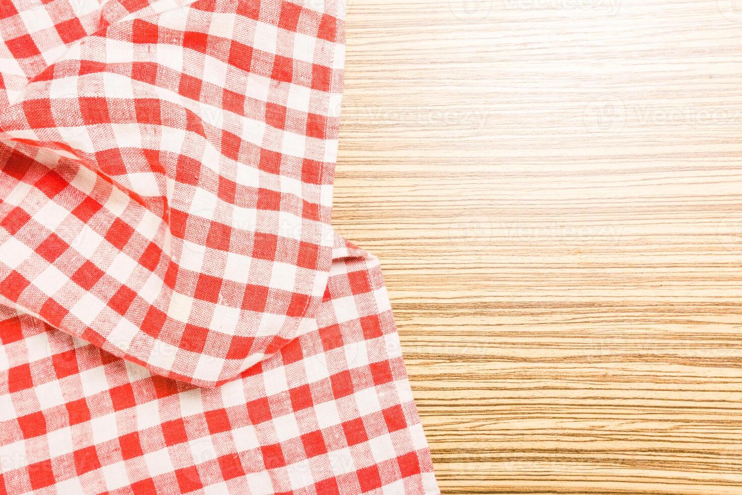 the checkered tablecloth on wooden table photo