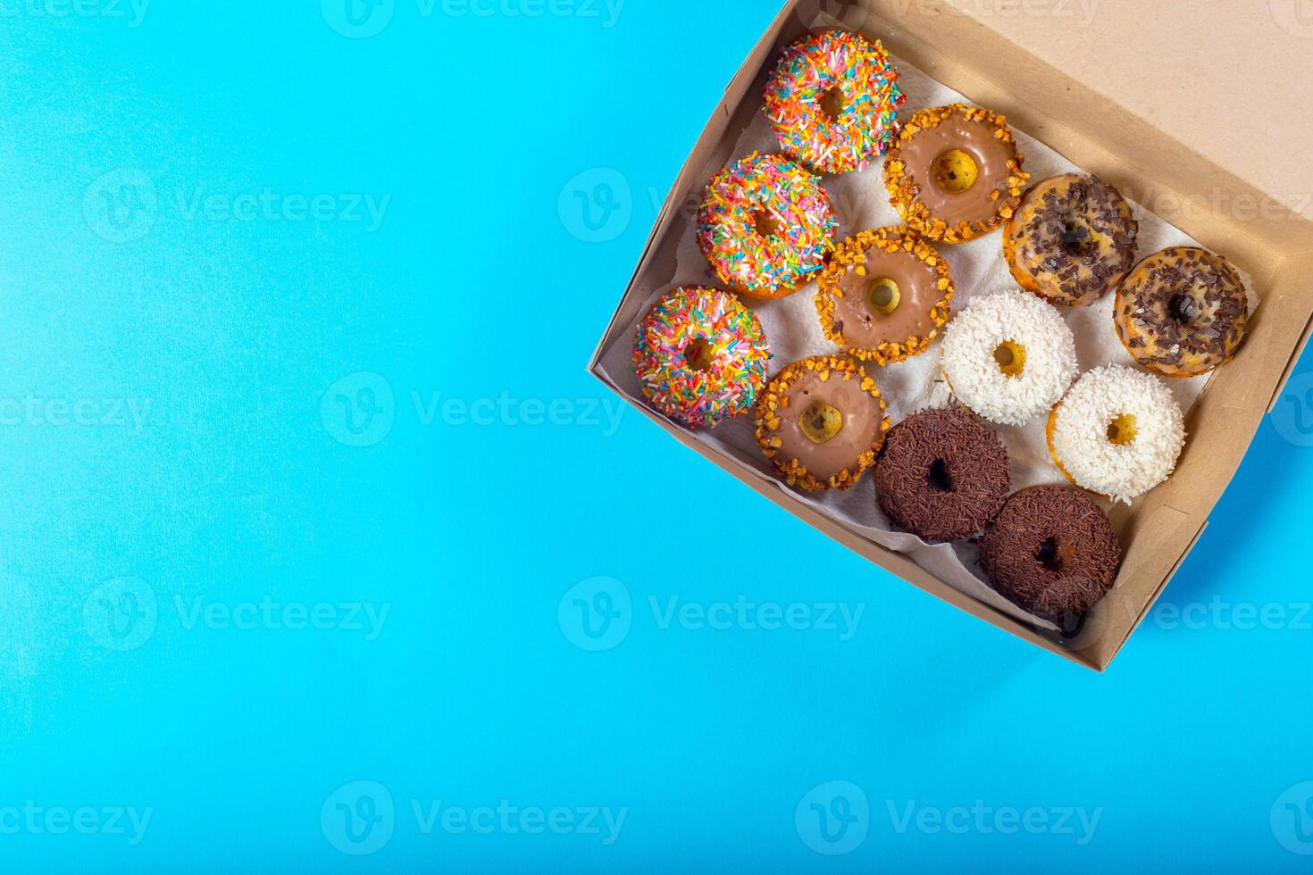 Colorful donuts in box photo