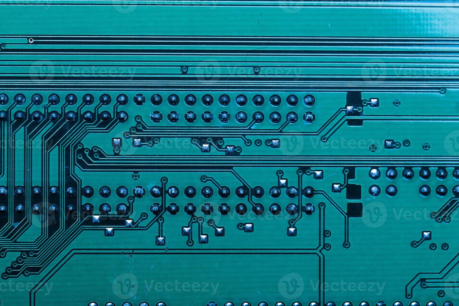 Close up of a printed green computer circuit board photo
