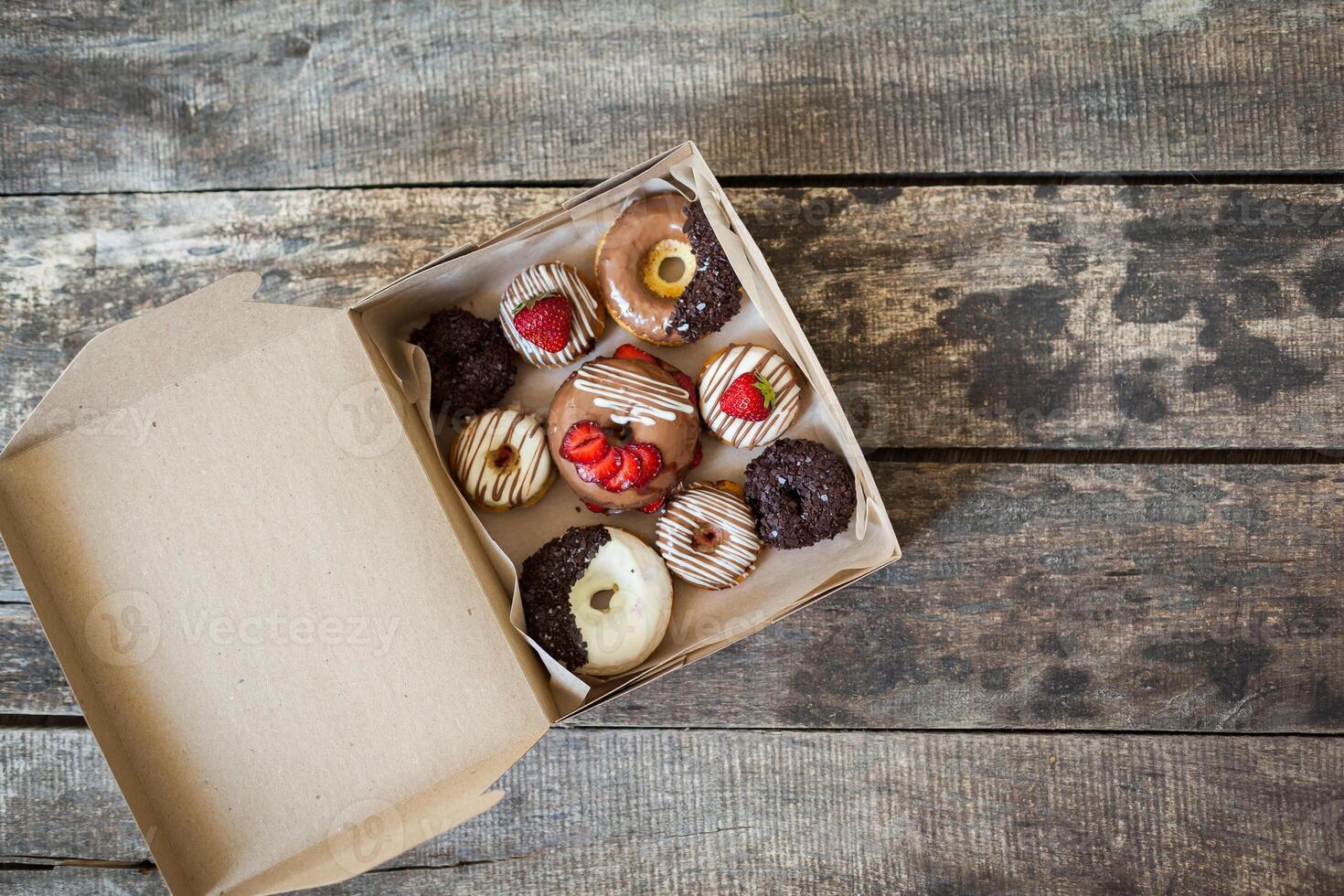 Colorful donuts in box photo