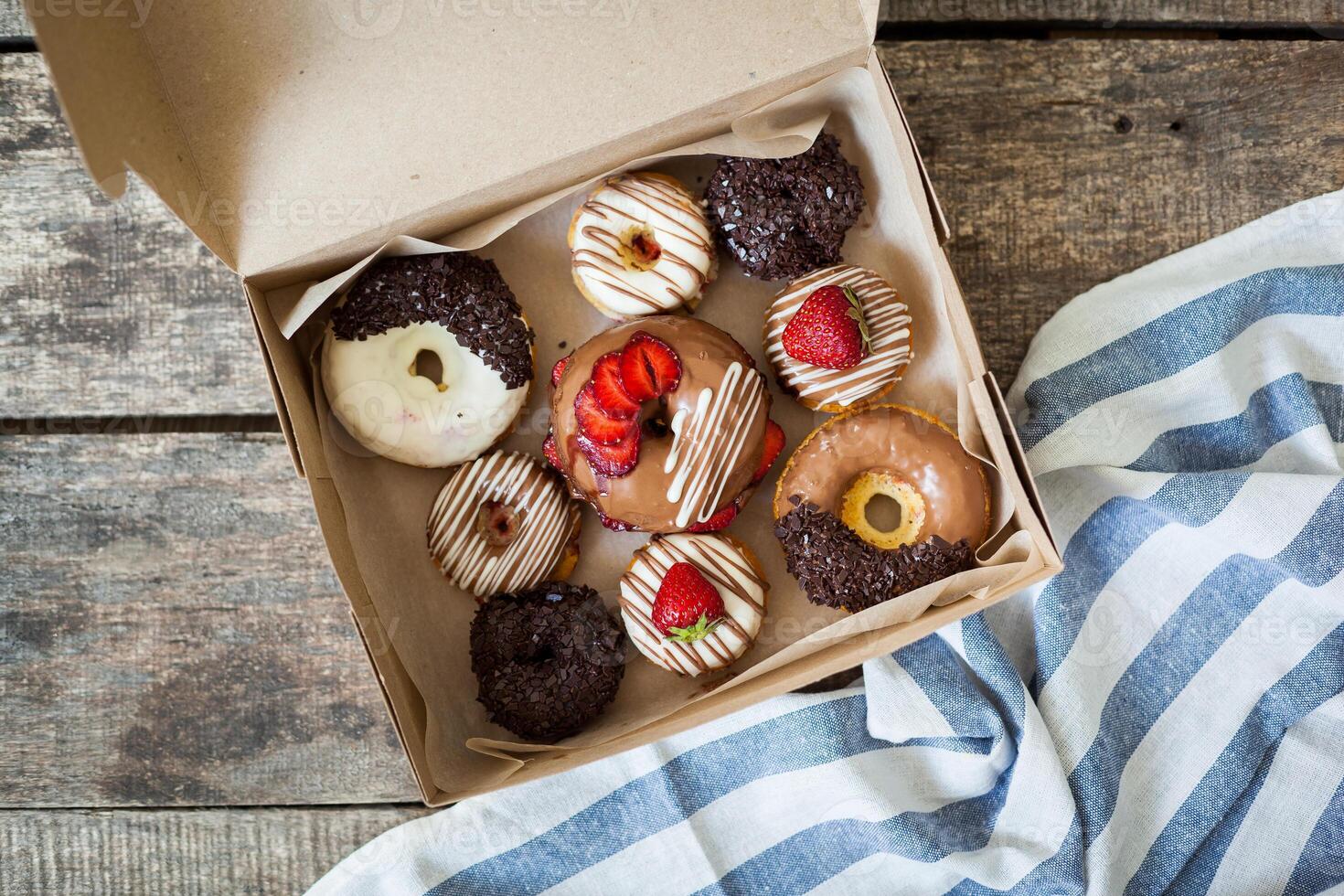 Colorful donuts in box photo