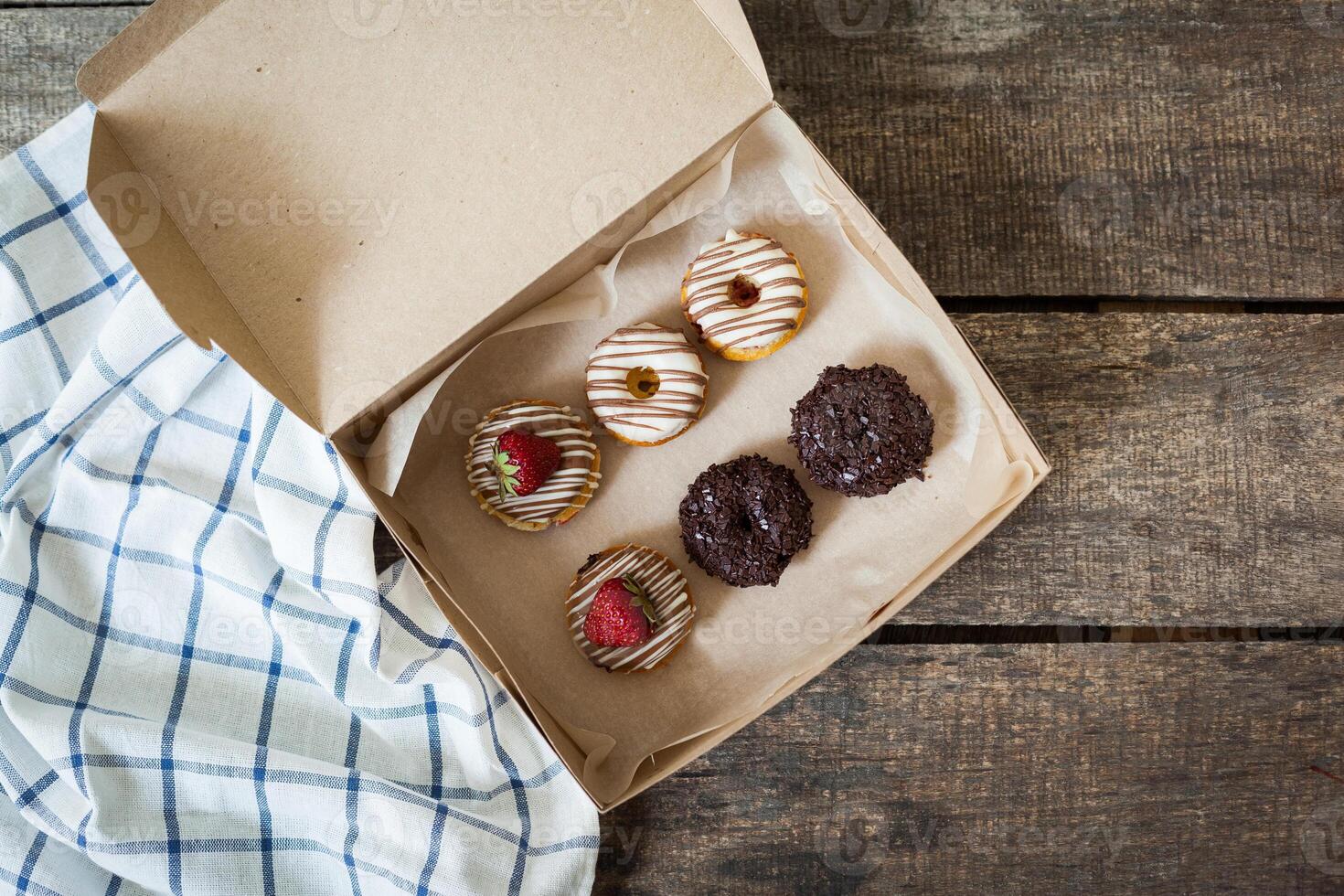 Colorful donuts in box photo
